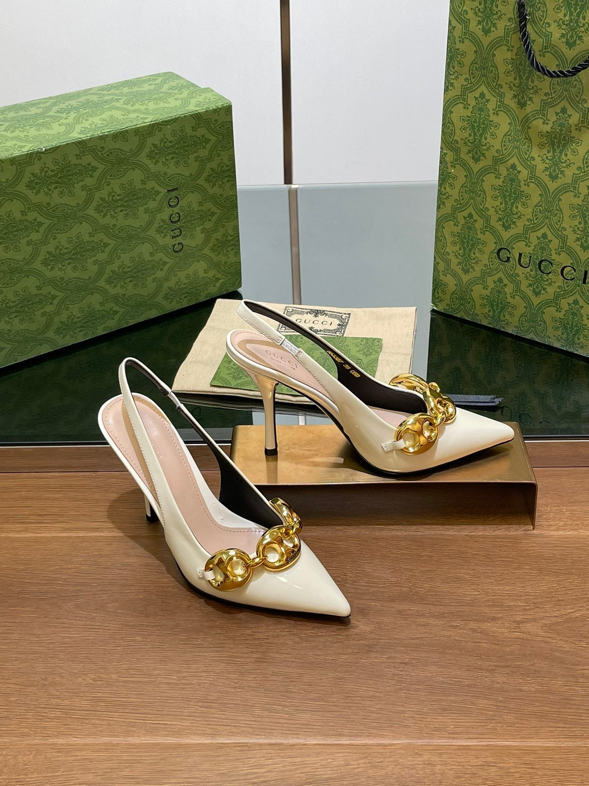 GG HIGH SLINGBACK 10.5 CM IN WHITE GLOSSY CALFSKIN WITH GOLD HARDWARE